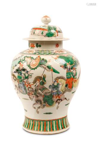 A CHINESE FAMILLE VERTE ‘WARRIORS’ JAR WITH COVER.