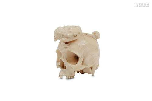 AN IVORY MODEL OF A SKULL. 19th/20th Century. Well