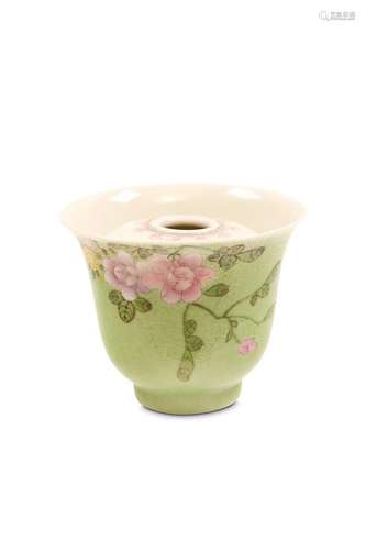 A CHINESE GREEN SGRAFFITO GROUND FAMILLE ROSE CUP.