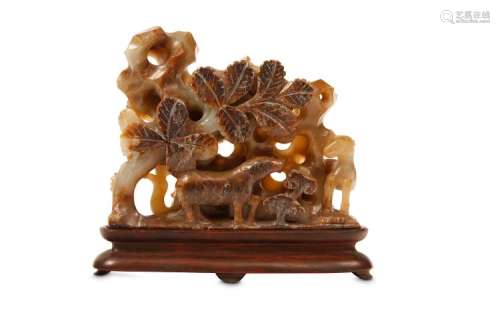 A CHINESE RUSSET JADE ‘RAMS’ CARVING. Qing Dynasty