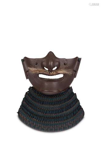 A RUSSET IRON MEMPO. Edo period. The face guard of