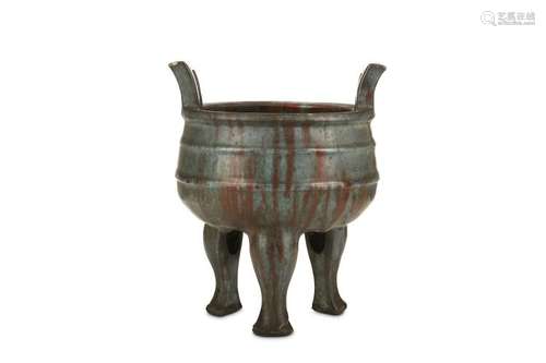 A CHINESE GLAZED TRIPOD CENSER. The rounded body w