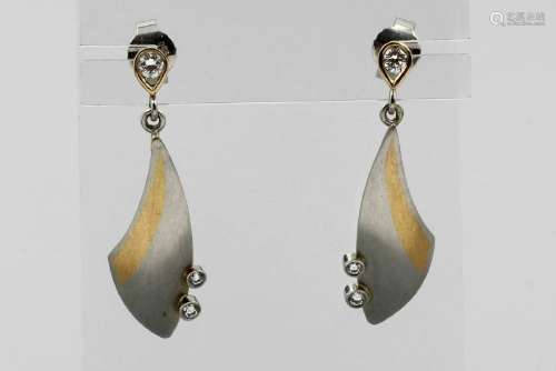 Pair of designer earrings with brilliants