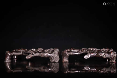 A QING DYNASTY RED SANDALWOOD INK REST