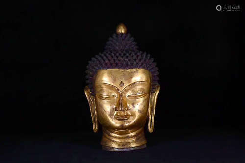 A TIBETAN BRONZE GILT BUDDHA HEAD STATUE, MING DYNASTY