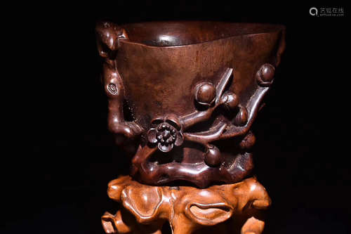 A HAINAN HUANGHUALI WOOD PLUM PATTERN CUP, LATE QING DYNASTY