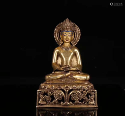 A TIBETAN GILT BRONZE YAO SHI FO STATUE