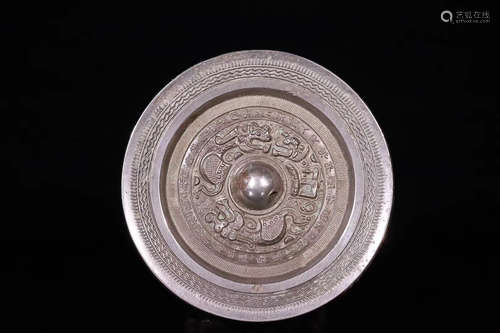 A HAN DYNASTY BRONZE MIRROR