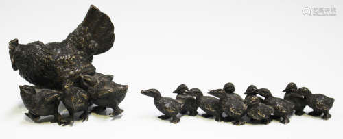 A 19th century French brown patinated cast bronze model of a chicken and her three chicks