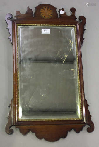 A late 19th century mahogany fretwork framed wall mirror with fan inlaid decoration