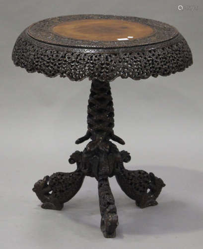 A late 19th/early 20th century Burmese carved hardwood wine table