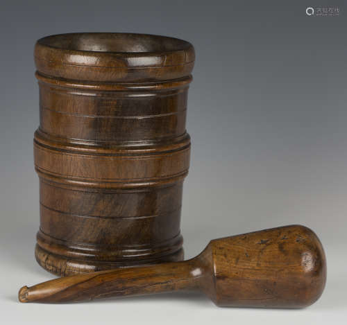 A 19th century lignum vitae mortar of slightly tapering cylindrical form