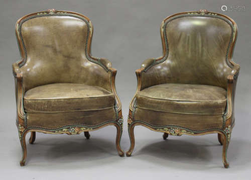 A pair of 20th century Louis XV style beech fauteuil armchairs