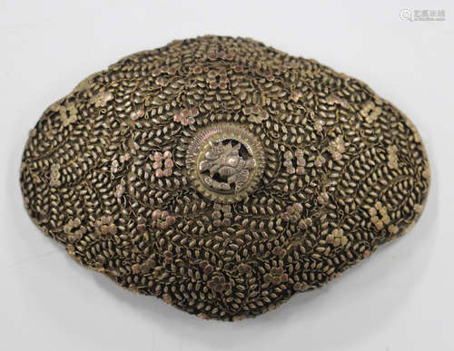 A 19th century Ottoman gilt metal and copper buckle plate of shaped oval form