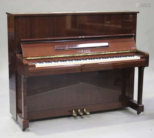 A Yamaha mahogany cased upright piano