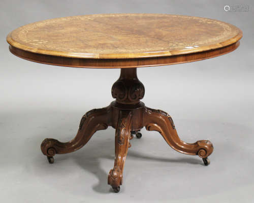 A mid-Victorian burr walnut oval tip-top breakfast table with inlaid decoration