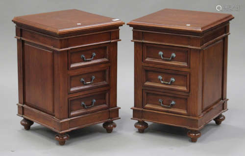 A pair of modern reproduction hardwood bedside chests