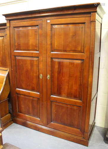 A modern cherrywood two door wardrobe