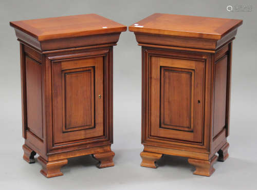 A pair of modern French style cherrywood bedside cabinets