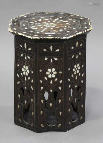 A late 19th/early 20th century Middle Eastern octagonal occasional table with overall mother-of-pearl and bone inlaid decoration