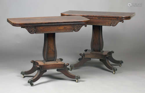 A pair of Regency rosewood fold-over tea tables