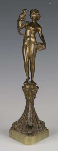 E. Caroni - a late 19th/early 20th century Continental patinated cast bronze full-length nude figure of a maiden holding a parrot and basket of flowers