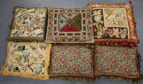 A Victorian woolwork and petit point cushion