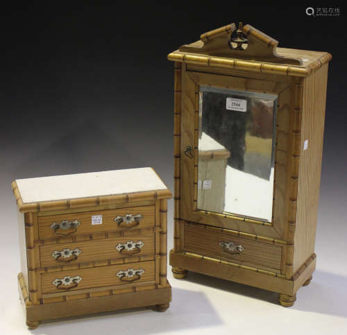 An early 20th century French pine diminutive model of an armoire