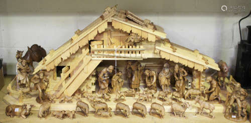 An extensive mid/late 20th century Black Forest carved softwood Nativity scene