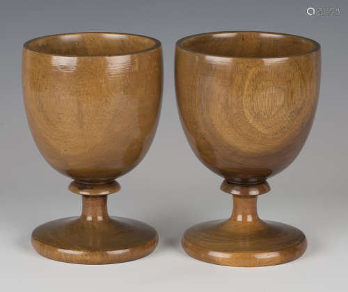 A pair of turned fruitwood goblets