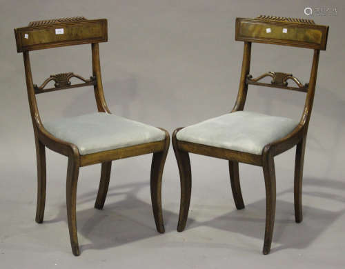 A pair of William IV mahogany bar back dining chairs with reeded decoration and pierced centre rails