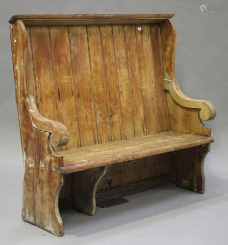 A late 19th century stripped pine settle