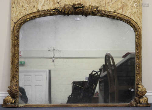 A late Victorian moulded composition overmantel mirror with fern surmount and leaf decoration