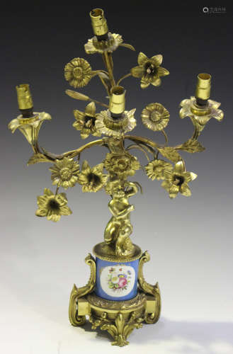 A late 19th century French cast ormolu and porcelain mounted four light candelabrum