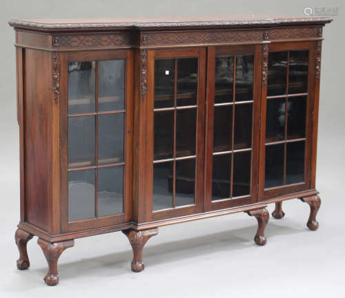 An early 20th century mahogany breakfront glazed bookcase