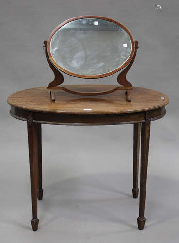 An Edwardian mahogany oval occasional table