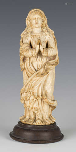 An 18th century carved ivory figure of the Virgin Mary