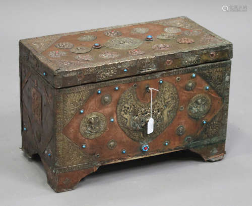 A 20th century Tibetan embossed brass and copper trunk