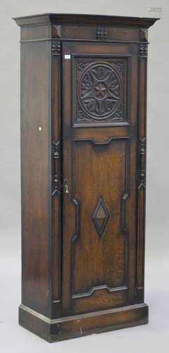 A George V oak narrow hall cabinet with carved and moulded decoration