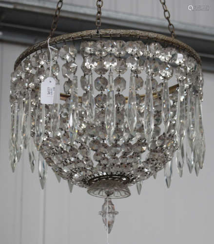 An early 20th century cast brass and cut glass basket chandelier