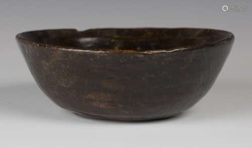 A turned wooden circular bowl