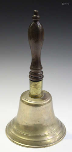 A late 19th century bronze hand bell with a turned mahogany handle
