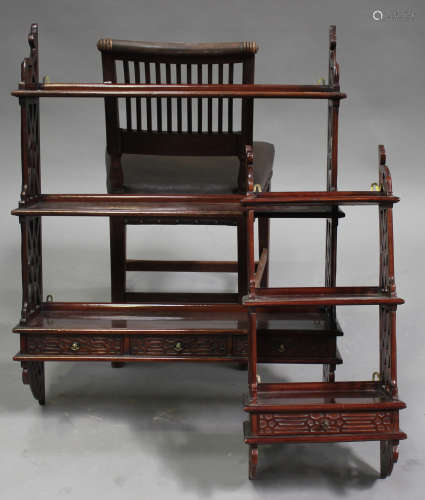A late 20th century reproduction Chippendale style mahogany three-tier wall shelf