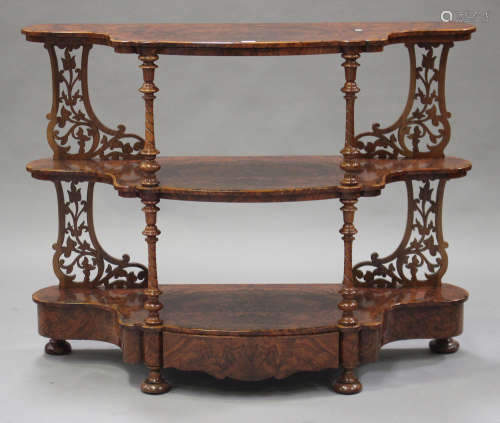 A mid-Victorian burr walnut three-tier whatnot