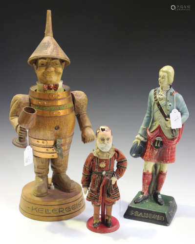 A mid-20th century German oak advertising figural table lamp