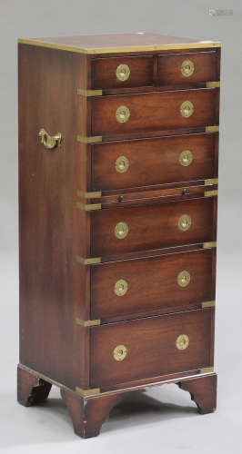 A late 20th century reproduction mahogany campaign style chest with brass mounts