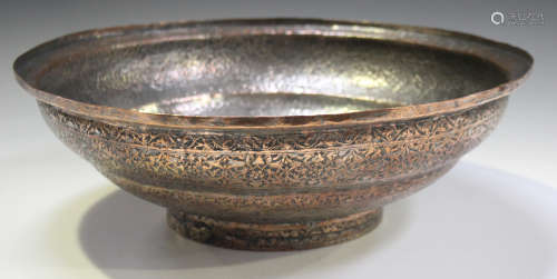 An early 20th century Indian plated copper circular rice bowl with overall foliate scrolling decoration