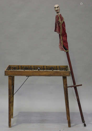 A late 19th century oak and stained beech folding skittles game