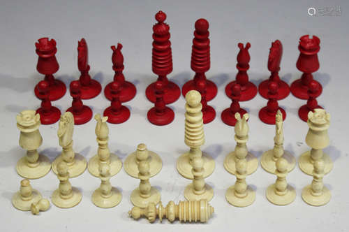 A late 19th century turned bone and red stained bone chess set