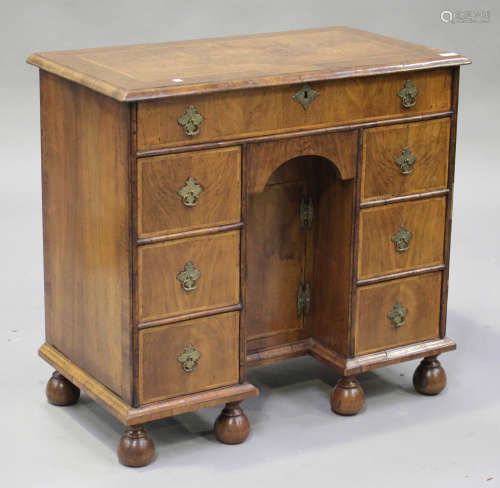 An early 20th century George I style walnut kneehole desk
